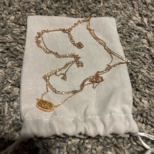 layered rose gold Kendra Scott necklace
